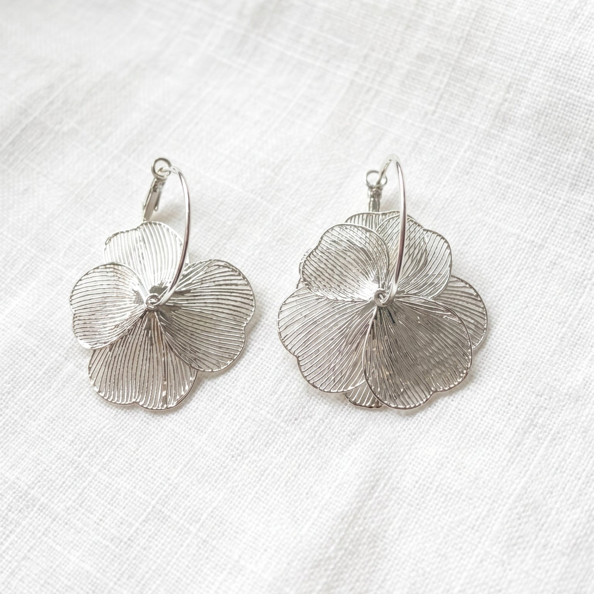 Silver flower drop earrings