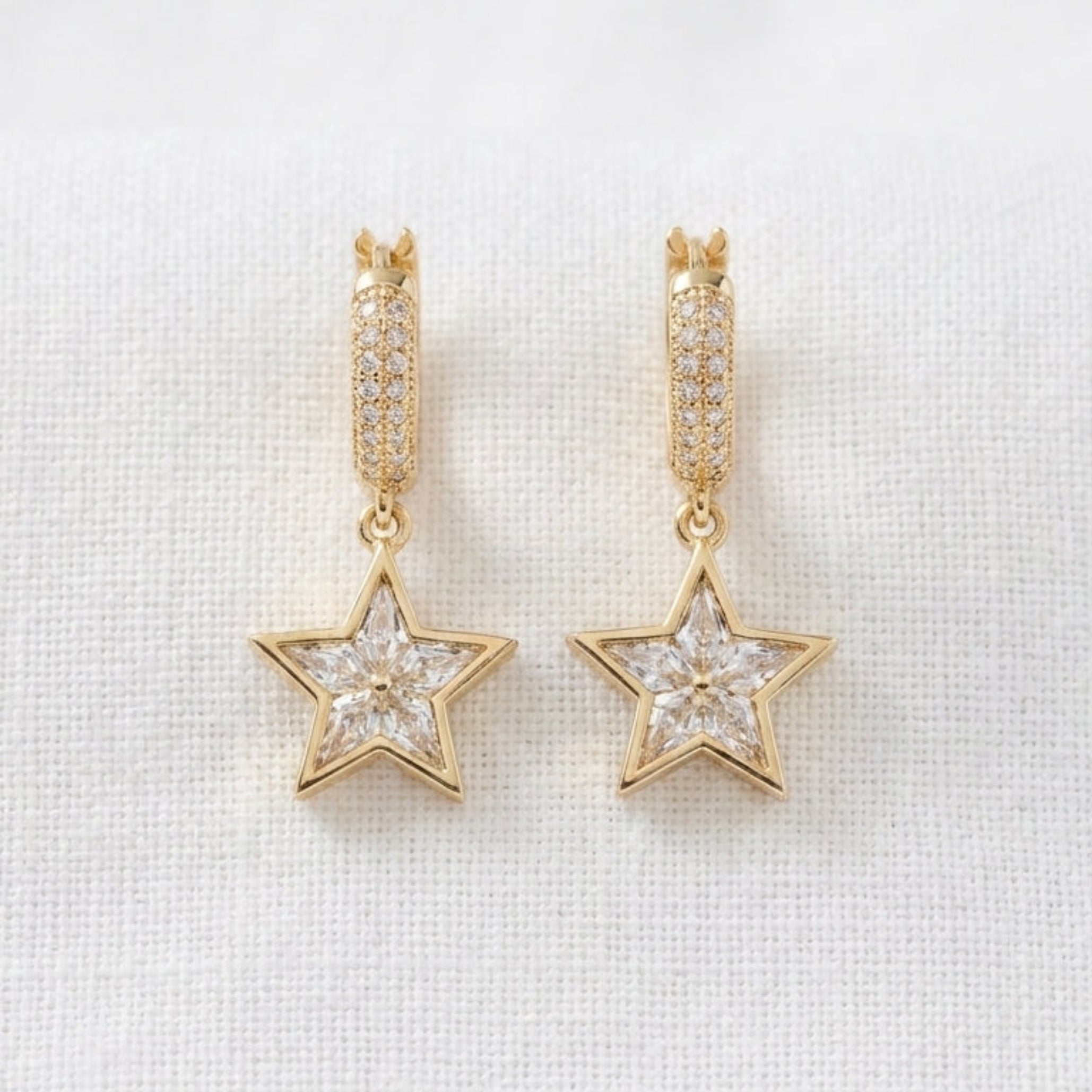 Gold star drop earrings