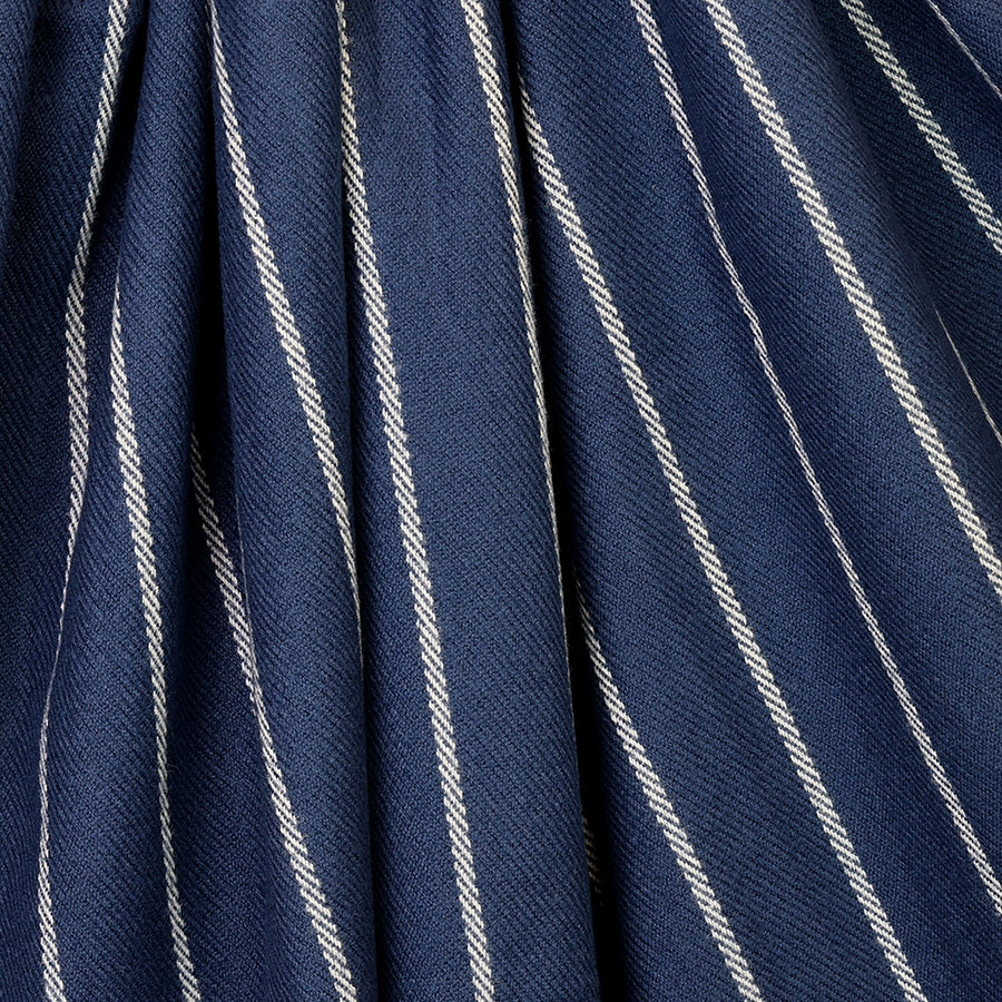 POM Henry navy pinstripe scarf looped on a mannequin stand against a white background, showing the full length of the deep navy scarf with fine cream pinstripe and navy tassel fringe ends.