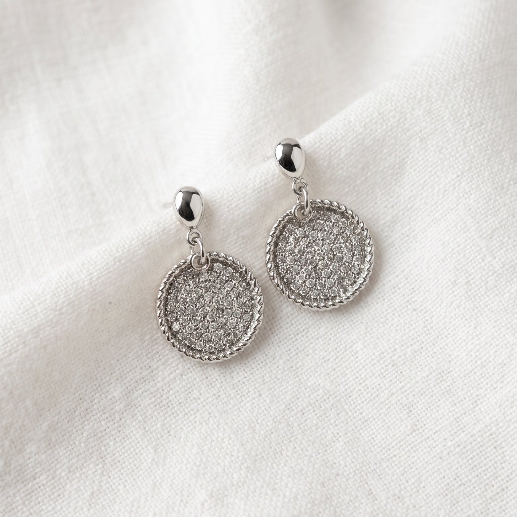 Silver disc drop earrings