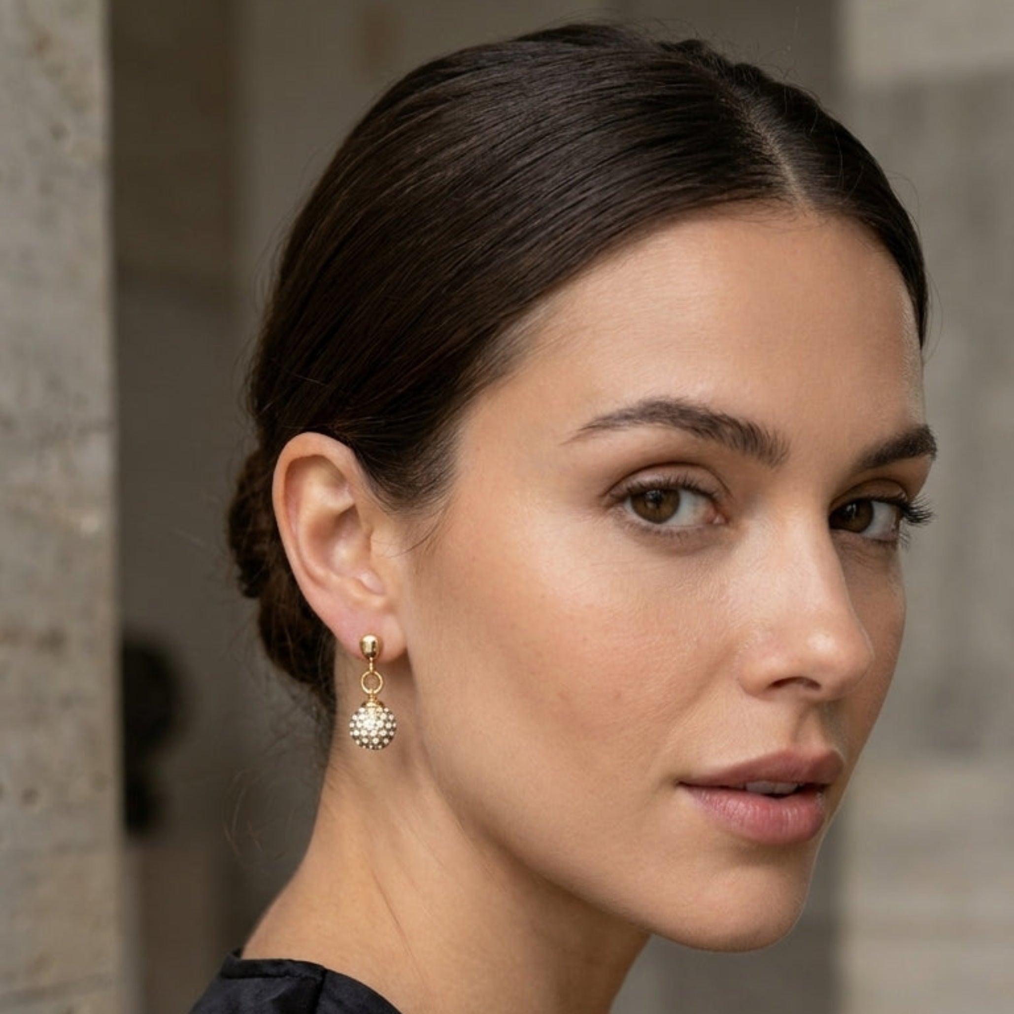 Gold stud earrings with crystal ball drop