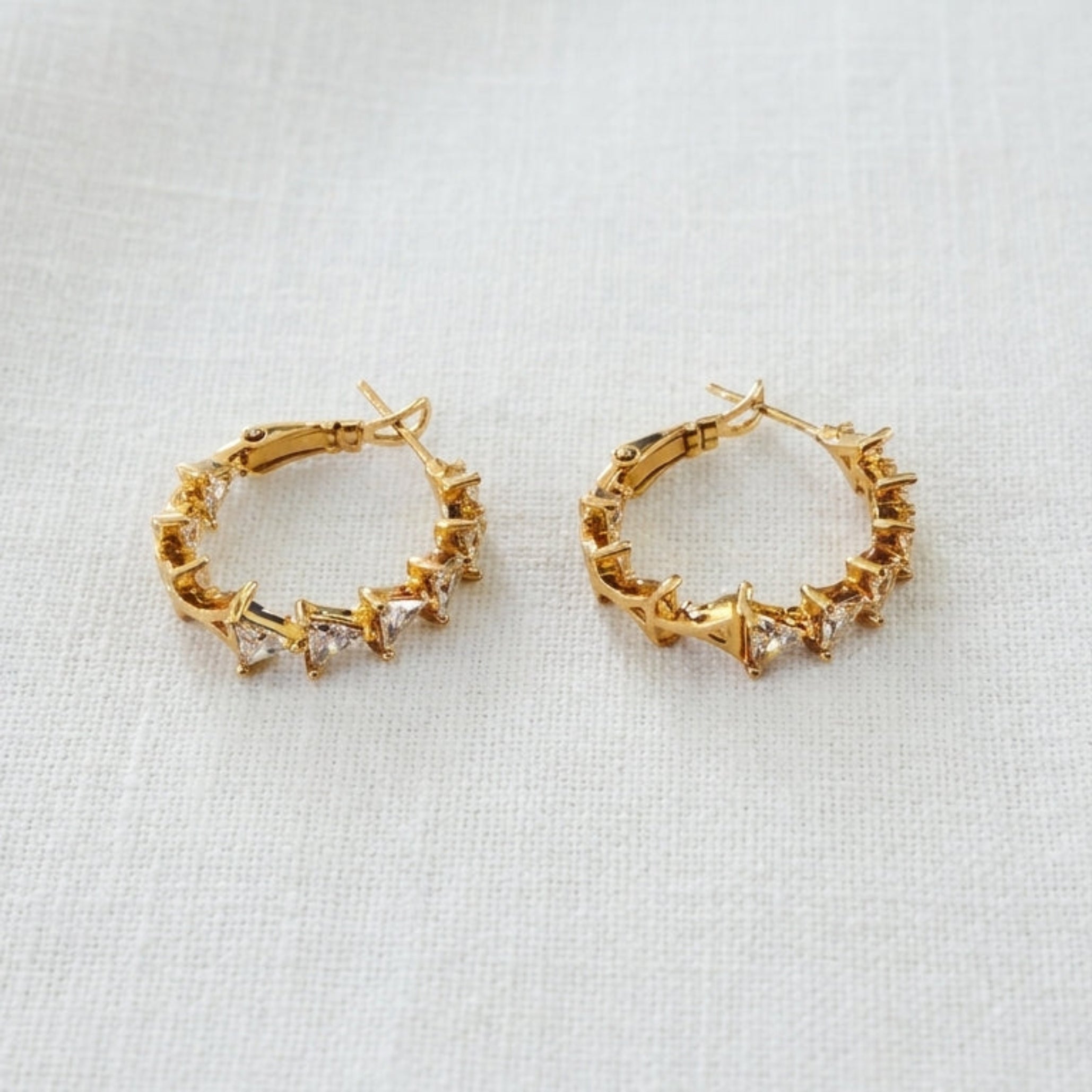 Gold textured spike hoop earrings