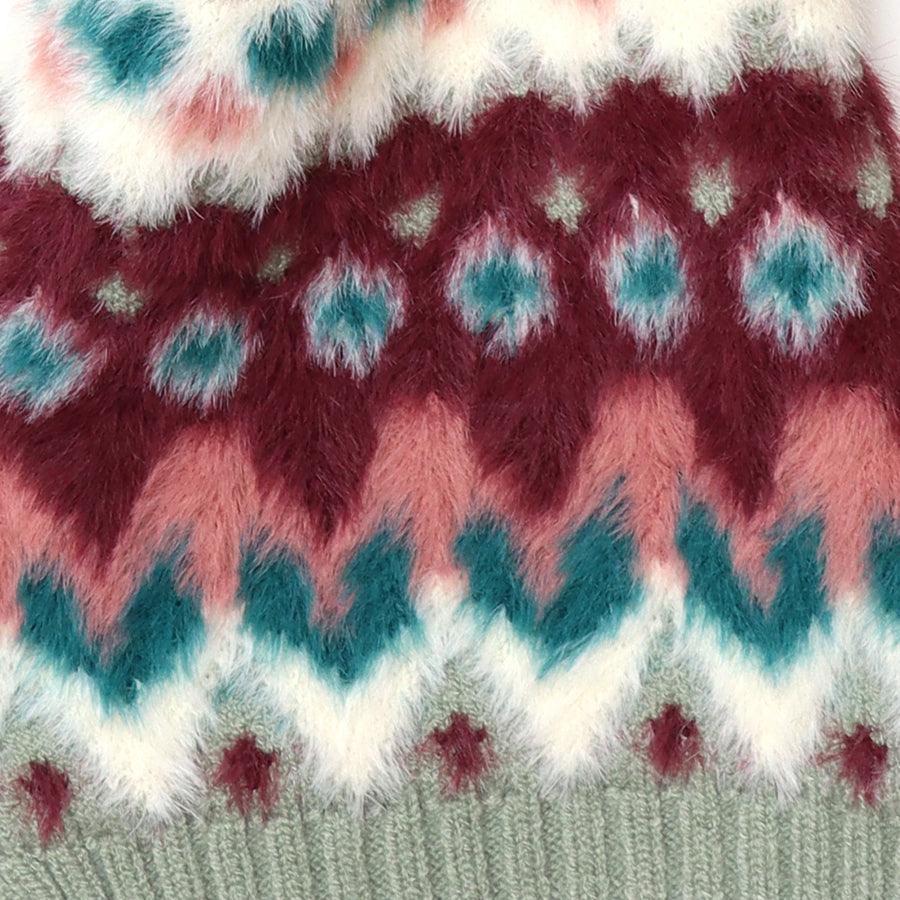 Close-up of the POM Imogen pull-through scarf fabric, showing the ultra-soft fluffy fair isle knit texture in burgundy, teal, blush pink and white with a sage ribbed border.
