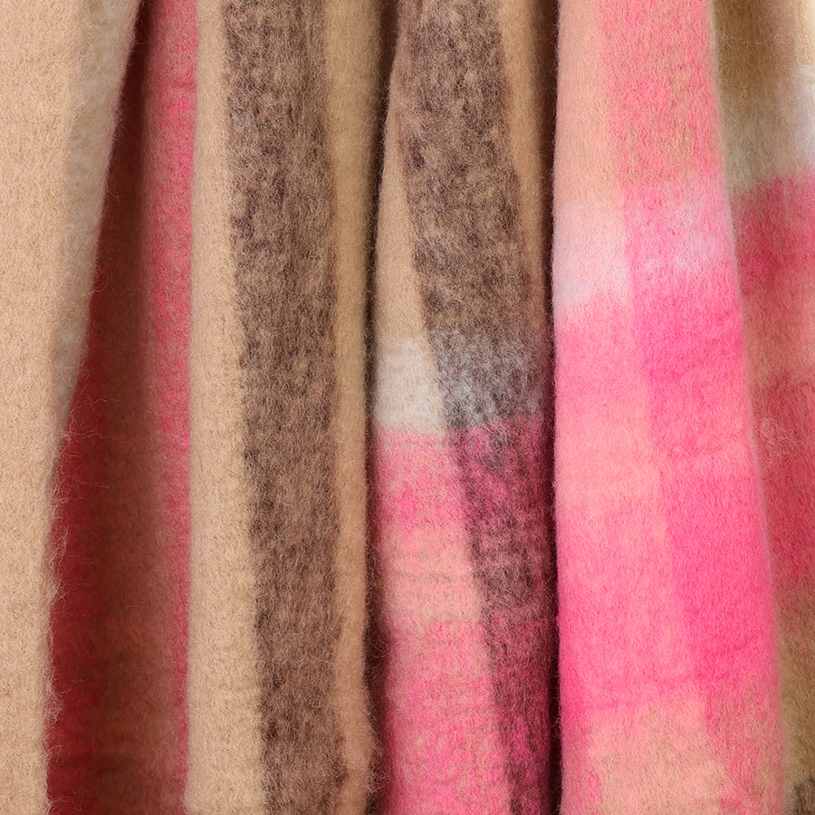Close-up of the POM Molly scarf fabric, showing the ultra-soft fluffy texture and warm mix of taupe, hot pink, blush and brown check stripes.