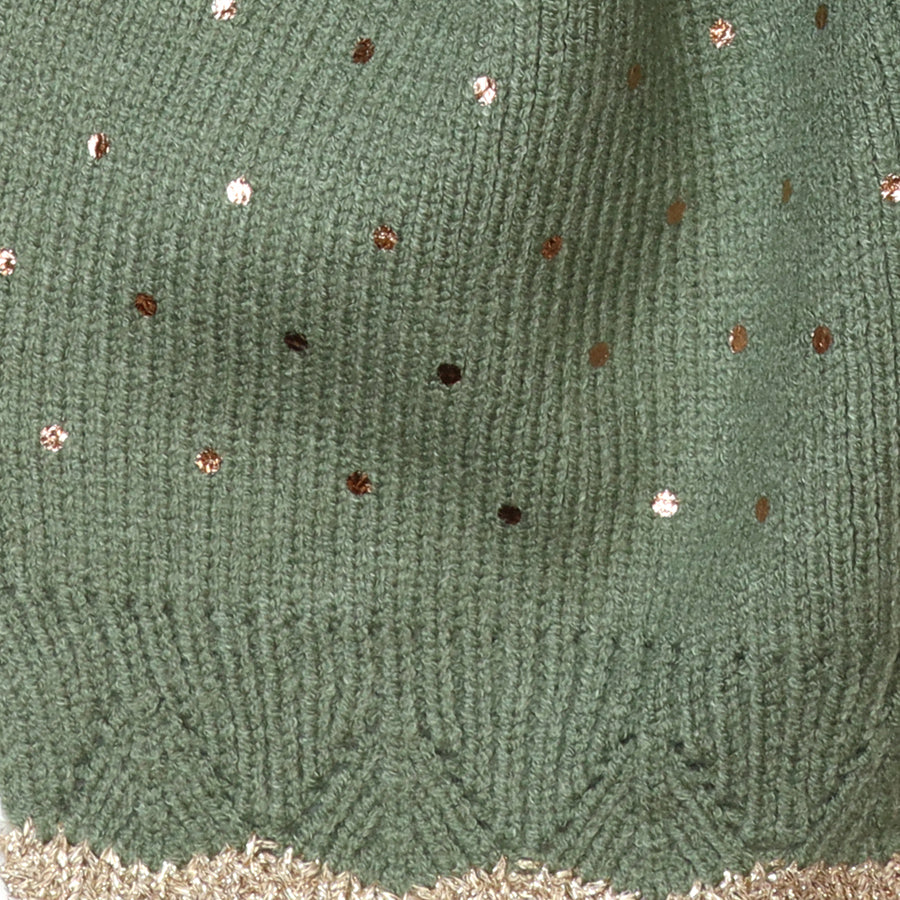 Close-up of the POM Yasmin sage green knitted pull-through scarf fabric, showing the scattered gold and rose gold metallic sequin spots on the soft ribbed knit with gold lurex trim at the edge.