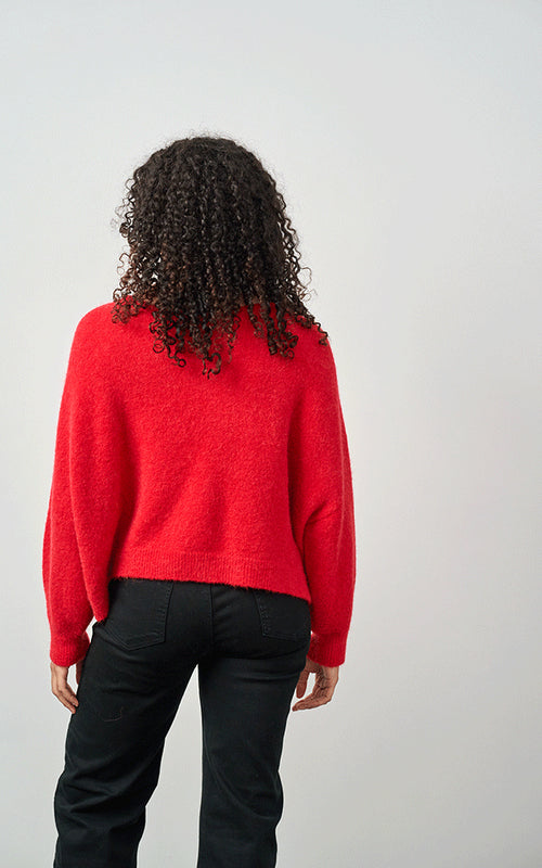 Woman wearing Luella Bettina red alpaca wool blend crew neck jumper with long sleeves