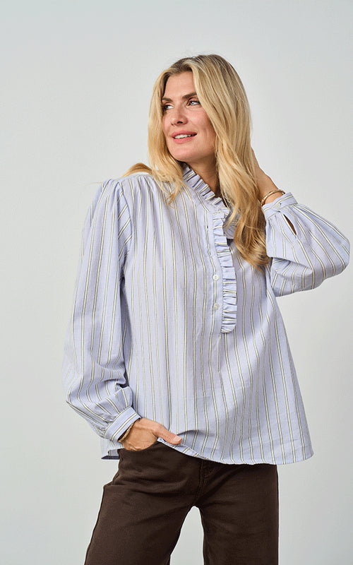 Woman wearing Luella Kinross blue and yellow stripe cotton blouse with frill collar and cuffs