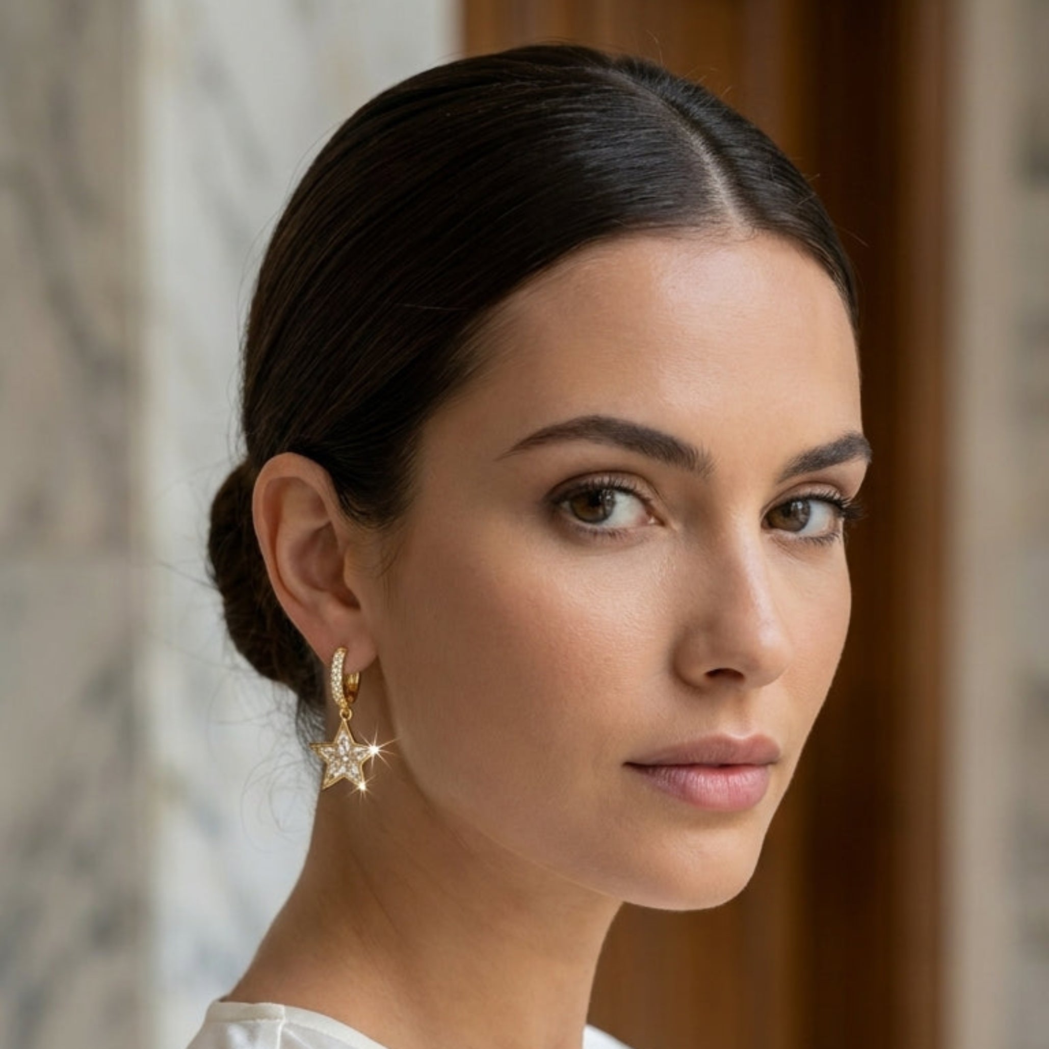 Gold star drop earrings