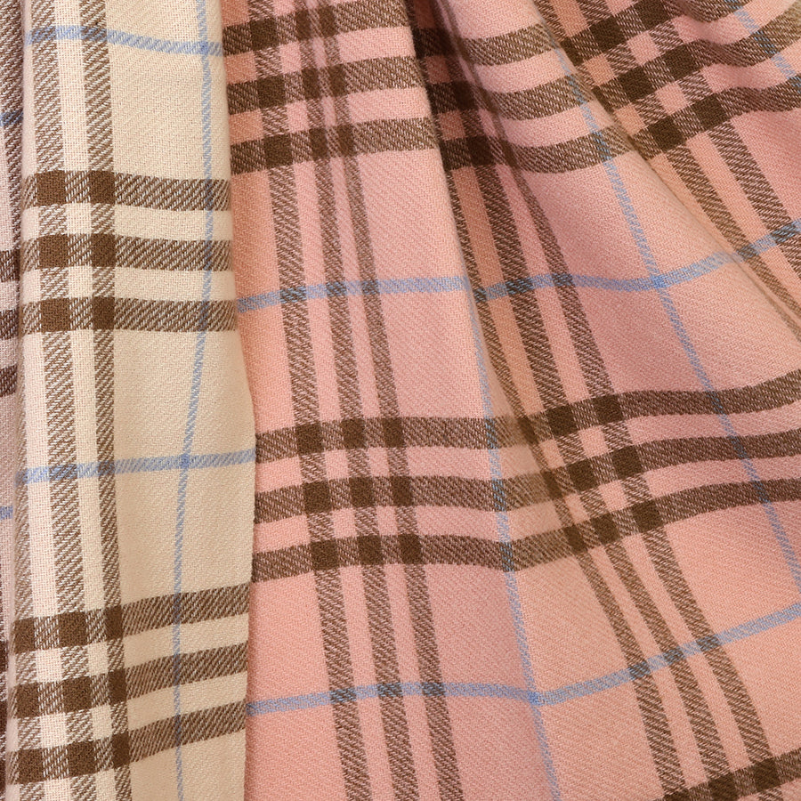 Close-up of the POM Nellie salmon pink, blue and brown mix check scarf fabric, showing the refined classic check in salmon pink and ecru with brown grid lines and delicate pale blue accent stripes woven throughout.