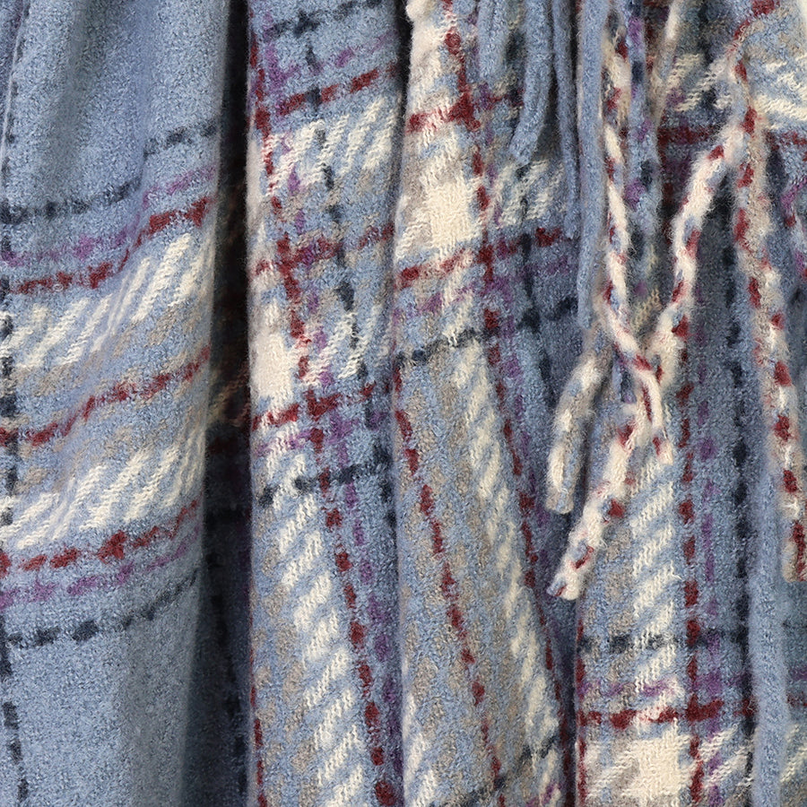 Close-up of the POM Darcie dusky blue mix fringe edge check scarf fabric, showing the soft textured weave in dusky blue, cream, burgundy and navy with the long twisted multicolour fringe edge detail.