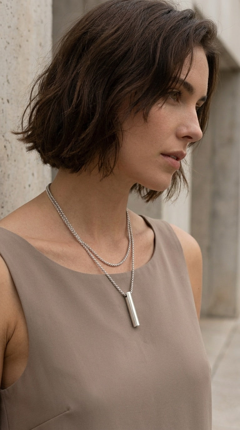 Model wearing Envy silver layered bar pendant necklace