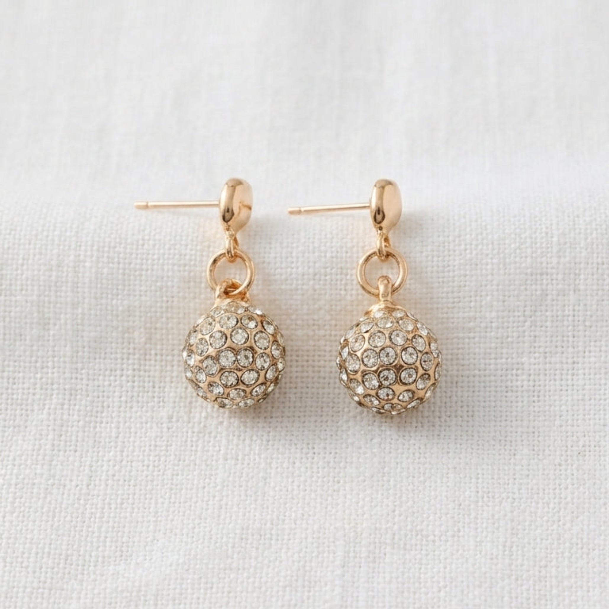 Gold stud earrings with crystal ball drop