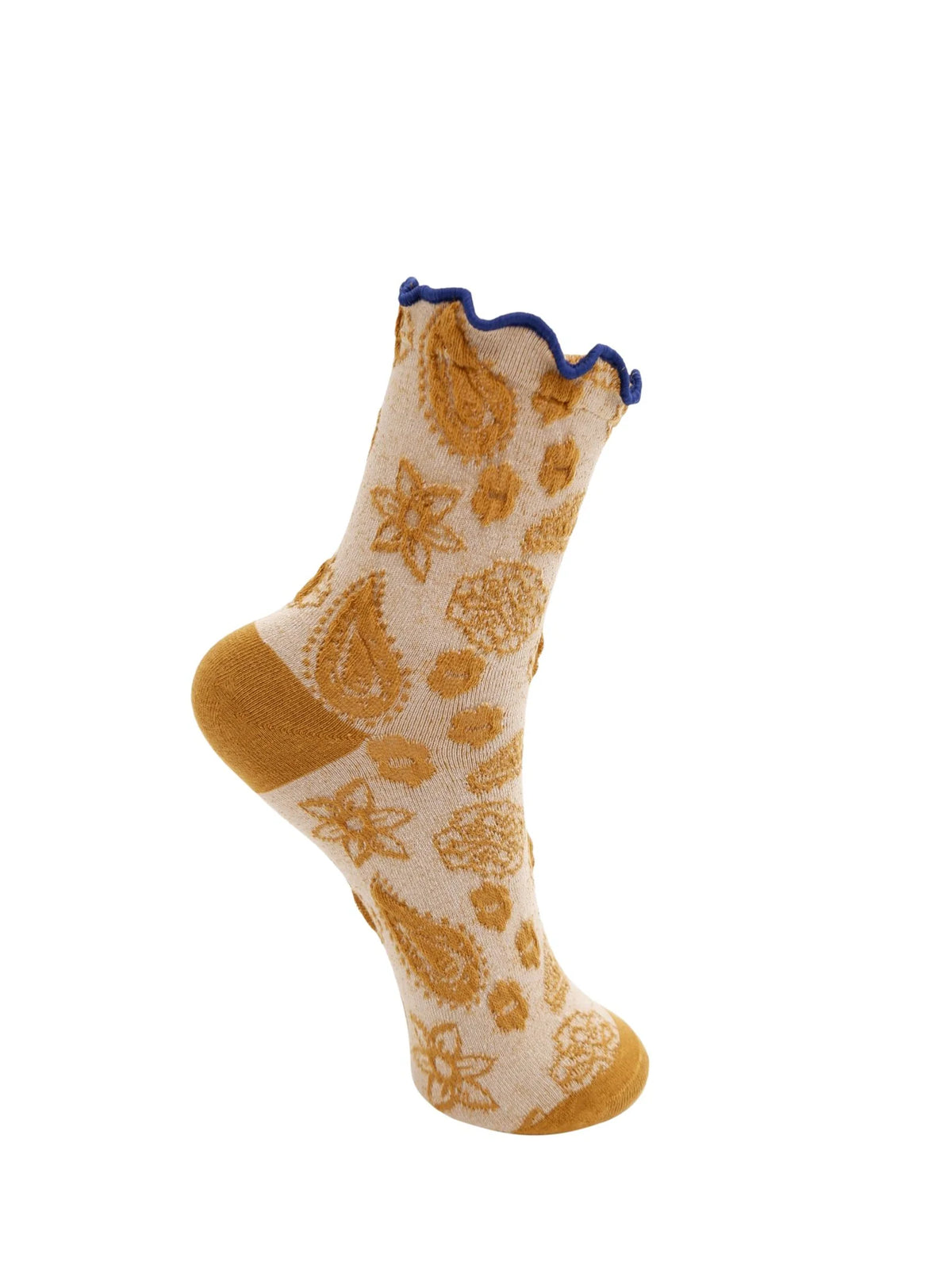 Black Colour BCFlow Sock in Mustard. A single cream-colored knit sock with a mustard yellow paisley and floral pattern, featuring a scalloped blue trim at the top and a solid mustard yellow heel, toe, and sole.