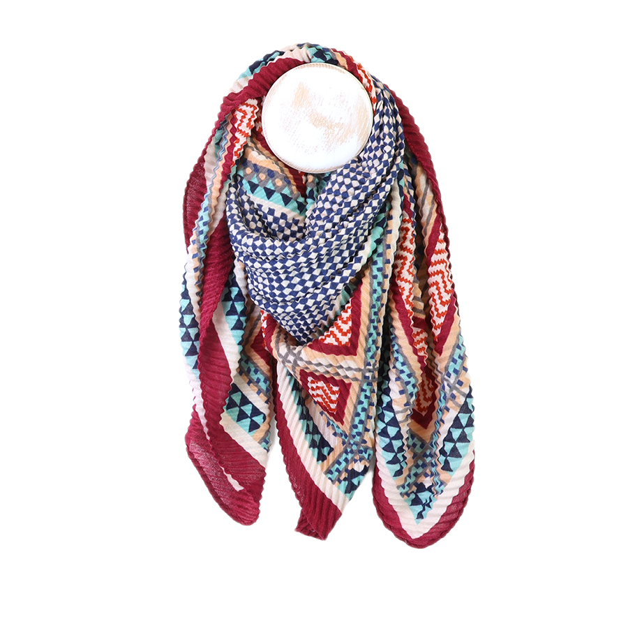 POM square wine, ecru and blue mix geometric crinkle scarf draped on a mannequin stand against a white background, showing the bold navy checkerboard, teal triangle, red and orange zigzag and ecru stripe pattern with deep wine border.