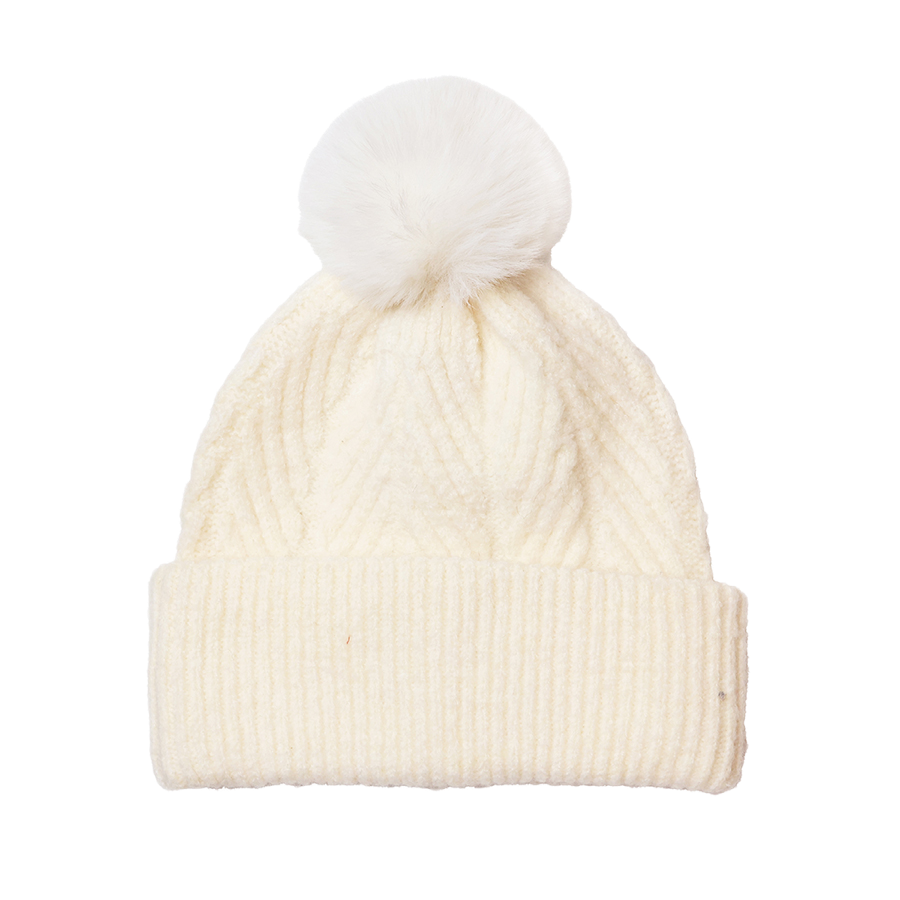 POM Charlotte cream cable-knit bobble hat with fluffy faux fur pom pom and ribbed turn-up brim, on a white background.